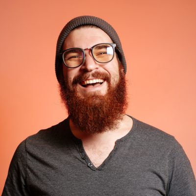 Close,Up,Portrait,Of,Happy,Smiling,Bearded,Hipster,Man,With