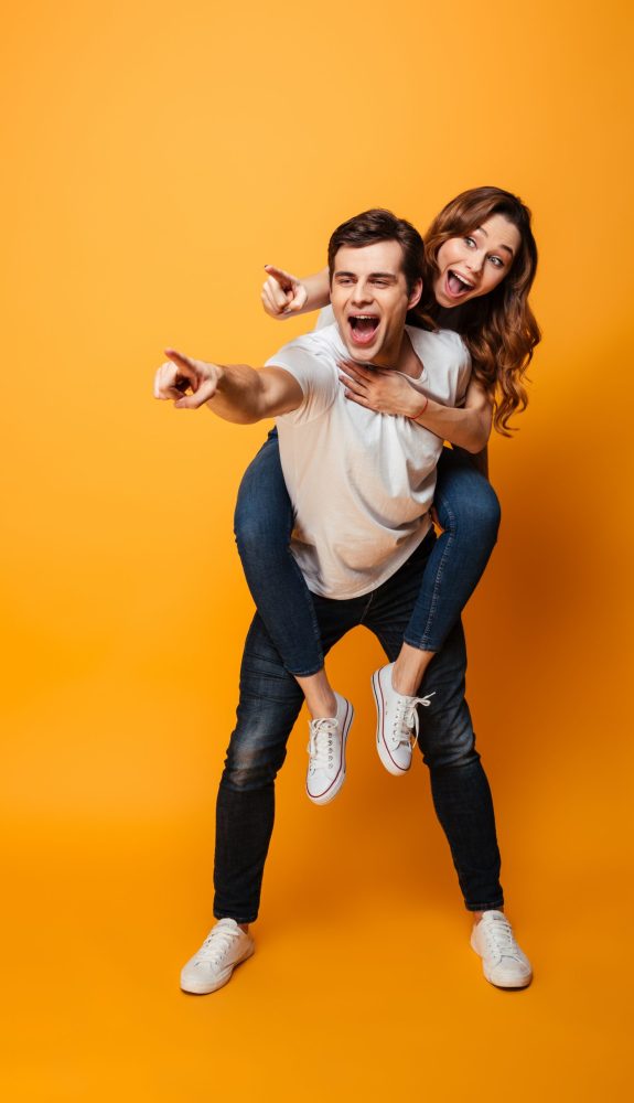 Full,Length,Image,Of,Happy,Young,Lovely,Couple,Having,Fun