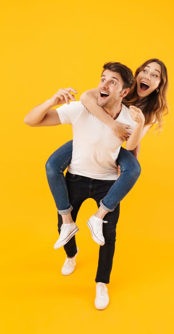 Full,Length,Portrait,Of,Pleased,Couple,Man,And,Woman,In